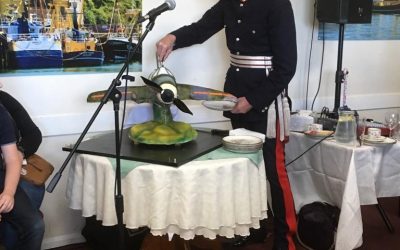 HM Lord-Lieutenant of Devon cuts commemorative spitfire cake for 75 year since D Day at Brixham