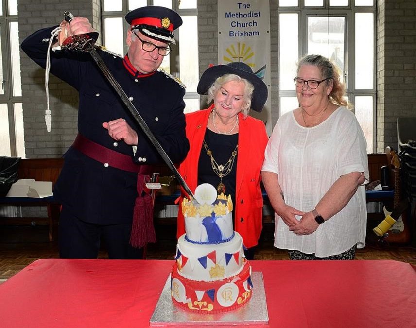 Deputy Lieutenant Nick Powe Cutting Brixham’s Coronation Cake